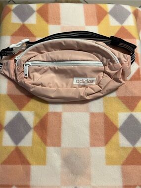 Peach colored Adidas Fanny Pack with Black Strap